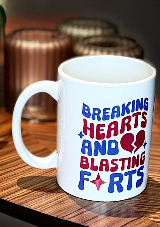 Breaking hearts and blasting farts novelty mug